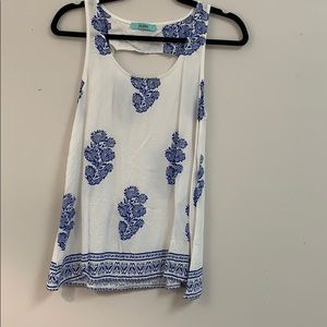 White Sleeveless Shirt with Royal Blue Pattern